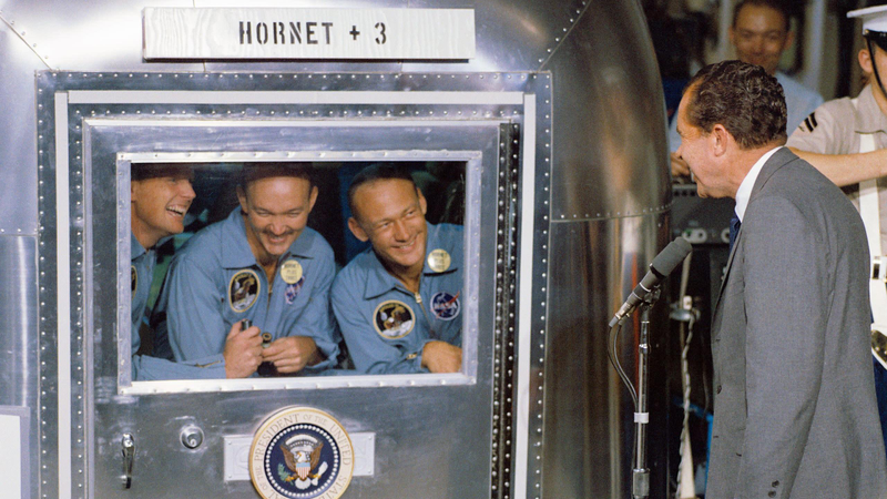 President Richard Nixon visiting the Apollo 11 crew in quarantine.